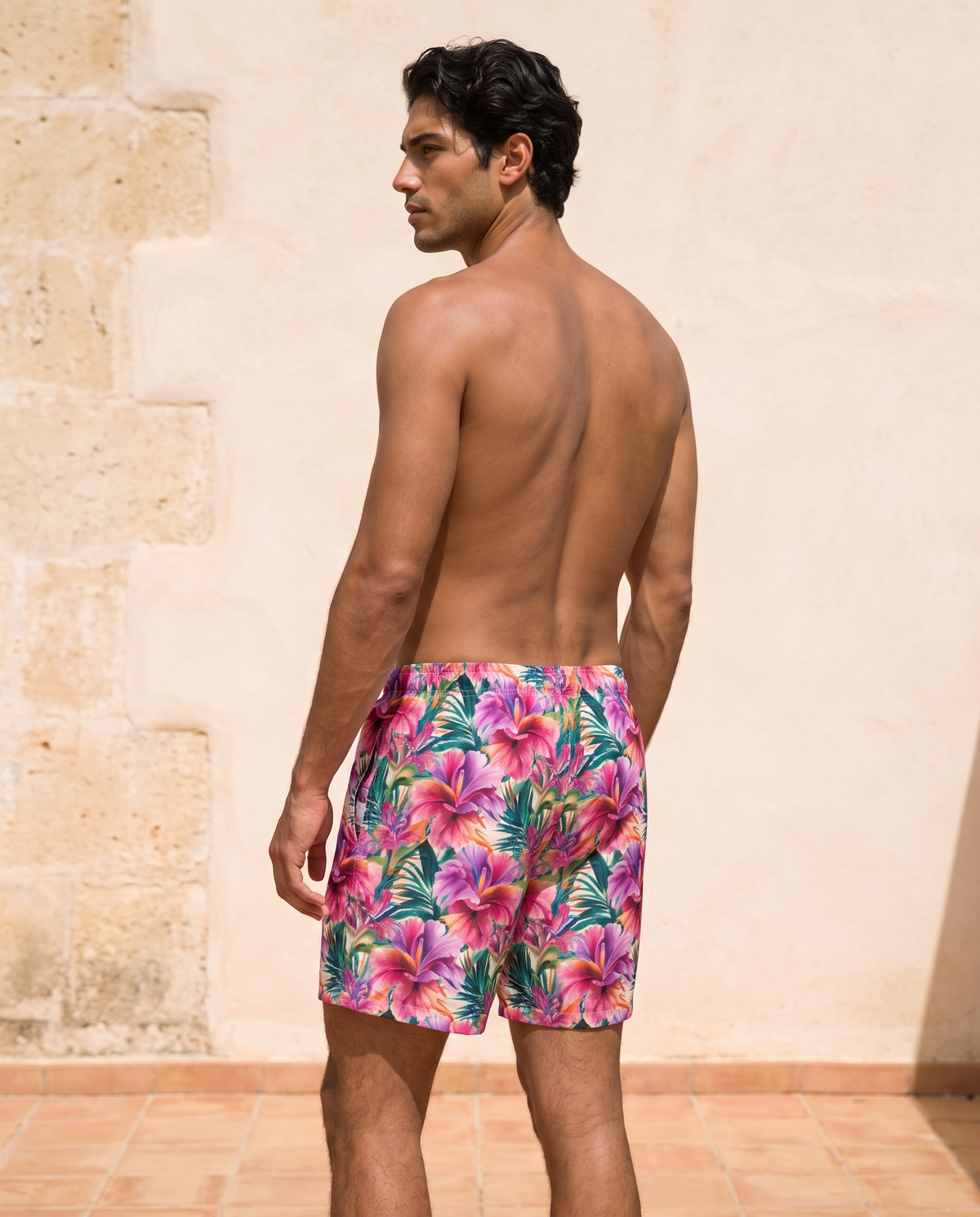 Vibrant Tropical Bloom men's swim trunks back view